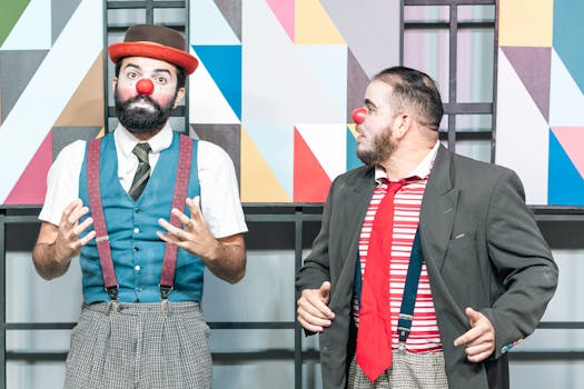 Two clowns in bright costumes performing against a geometric backdrop, showcasing entertainment art.