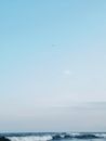 Peaceful ocean waves under a clear sky at Praia dos Sonhos, perfect for a soothing wallpaper.